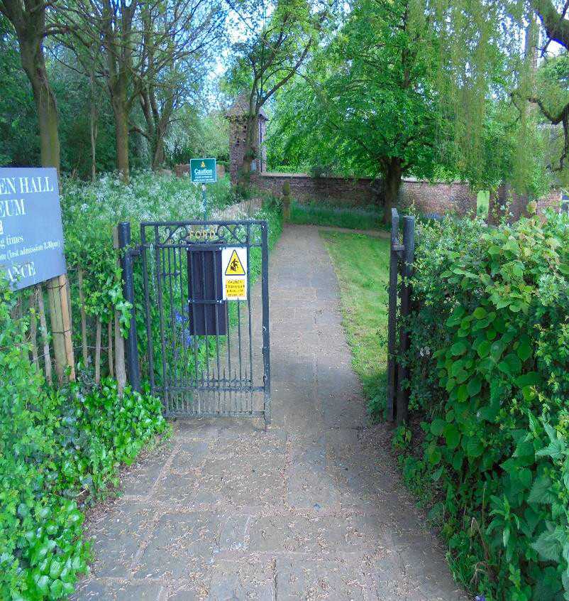 The front gate of the hall - a paved path sloping towards the hall